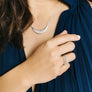 Woman wearing set of minimalist stacking rings in silver