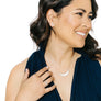 Woman wearing minimalist crescent moon earrings in silver