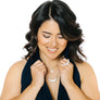Woman wearing statement crescent moon ring in silver with matching crescent moon necklaces