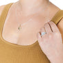 Woman wearing minimalist silver full moon ring