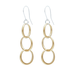 Minimalist interlocking ring trio earrings in yellow bronze and sterling silver ear wires