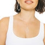 Woman wearing minimalist kite necklace and earrings in sterling silver