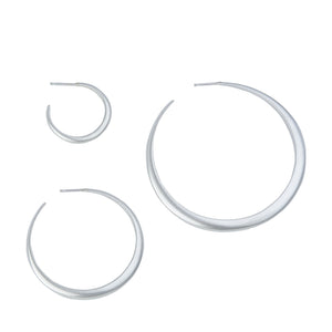 Minimalist crescent hoop earrings in silver (small, medium and statement sizes).