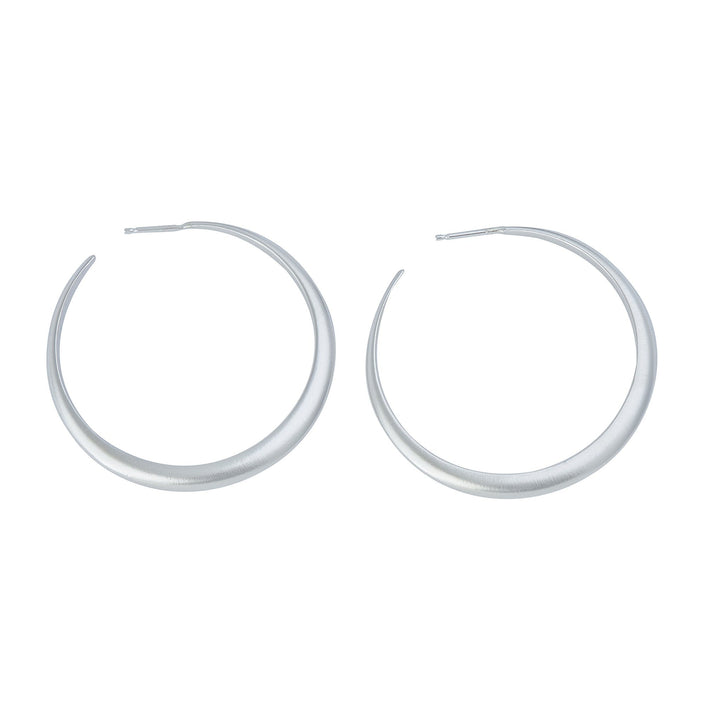 Minimalist crescent hoop earrings in silver.